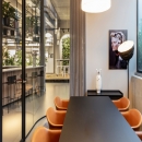 Inside a meeting room with curved glass partition