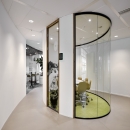 Oval conversation room made of single glass and closed panels
