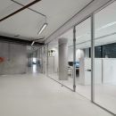 Single glass partition with sliding doors