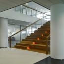 Cental staircase with double glass walls at Ernst & Young Venlo, The Netherlands