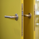 QbiQ lock in a steel door. The door frame is made of aluminum with a steel sheet added.
