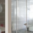 IQ-Single glass wall with tampered glass door an text design foil added