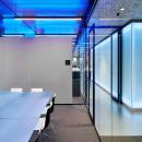Fire resistant glass partition, dividing two offices.