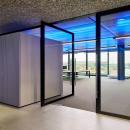 Aluminum framed pivoting door with glass at The Flow Houthavens Amsterdam.