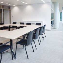 Meeting room with high acoustic glass partition.