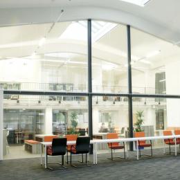 Extra high arc shape glass wall with steel construction and double doors
