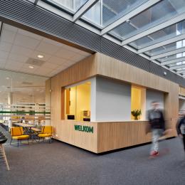 Entrance / reception with left glass wall view to canteen Seeligkazerne Breda