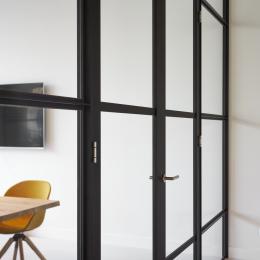 Double doors in a classic industrial glass wall