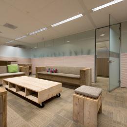 Partitions wall of acoustic laminated glass with wood panels and privacy film added