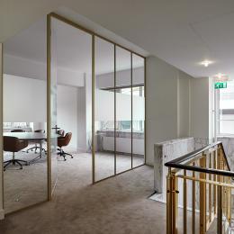Boardroom with single glass wall in alugold profiles