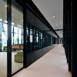 Corridor with a meeting room on the left side
