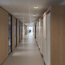 Corridor with closed partition and aluminum framed doors