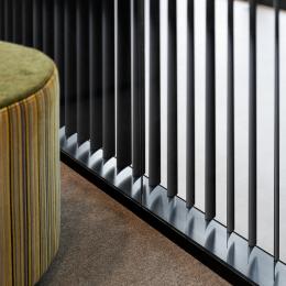 A close up of a partition wall with blinds inside