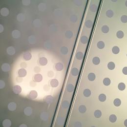 Double glass partition wall with a dots print film added