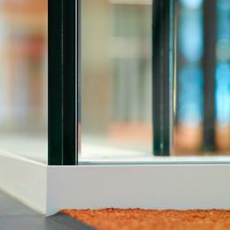 Detail of double glass partition wall 90 degrees corner