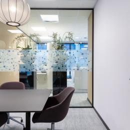 Meeting room with glass and closed wall parts at Novo Nordisk Alphen aan den Rijn