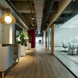 Offices with barn doors and glass partitions.
