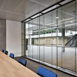 Full glass cabinet against an IQ Single partition wall