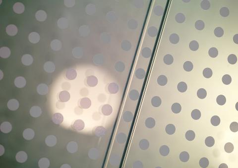 Double glass partition wall with a dots print film added