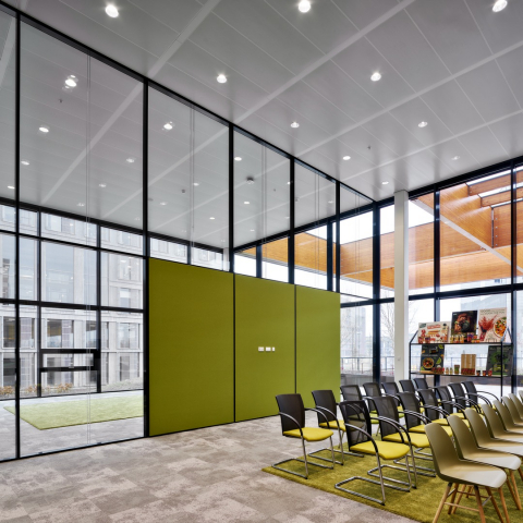 Inside a meeting room with partition walls and acoustic panels